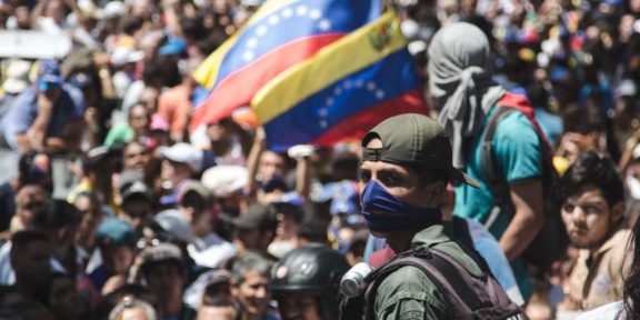 Soldier wearing blue bandana supports Juan Guaido