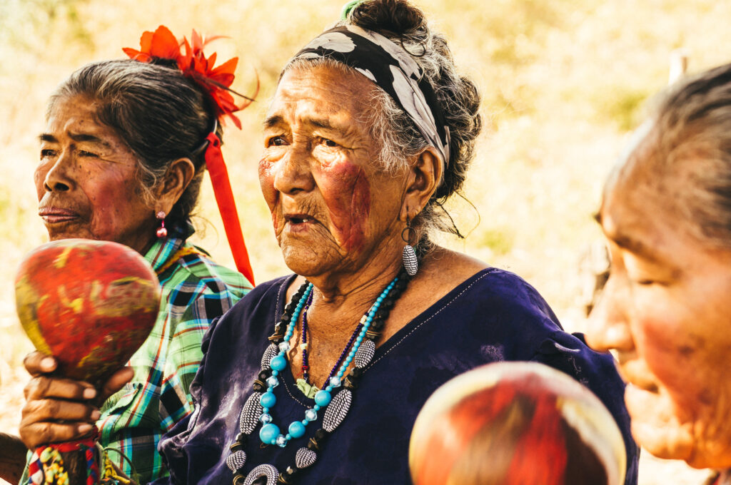 Indigenous women in Paraguay singing and protesting