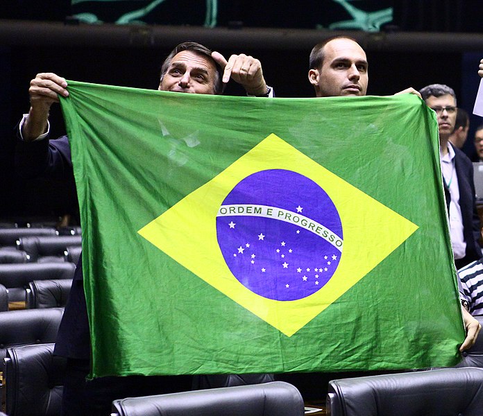 Jair Bolsonaro and Eduardo Bolsonaro with Brazilian Flag