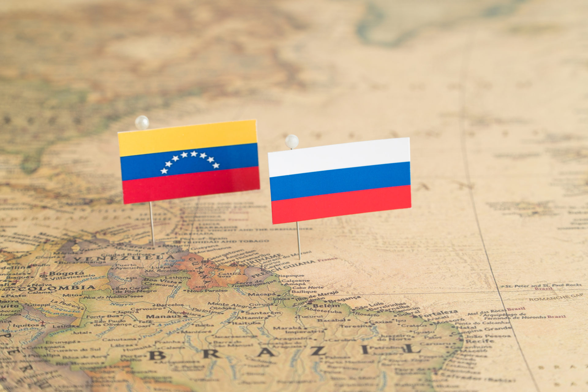 Venezuela and Russian flags on a map